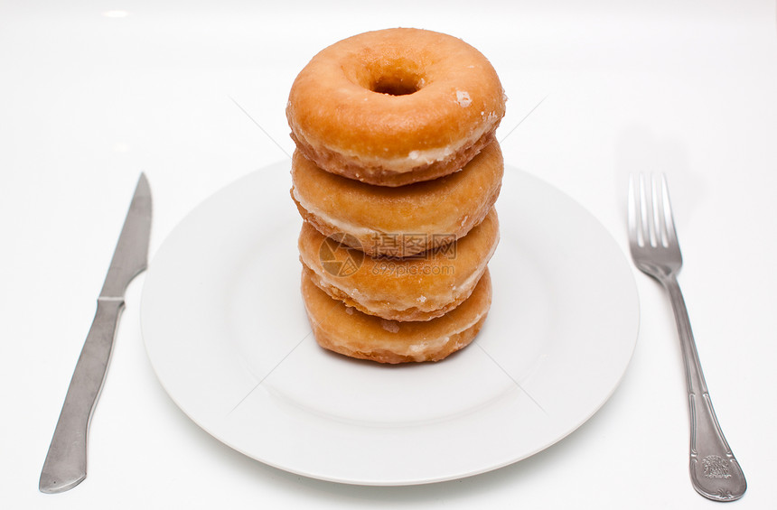 盘子上的甜甜圈早餐食物健康体重图片