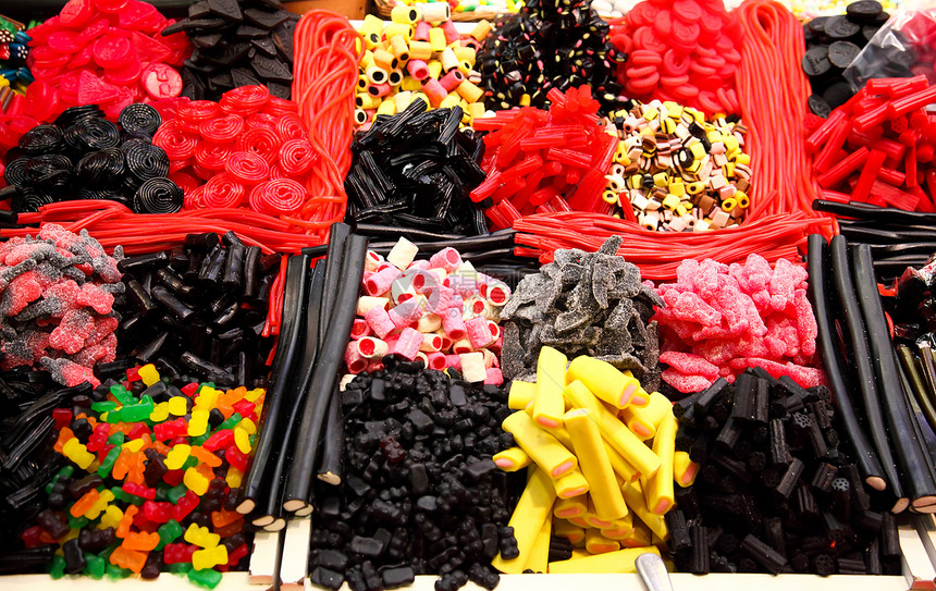 供应商在巴塞罗那一个农民市场展出矿物小贩坚果糖果展示水果图片