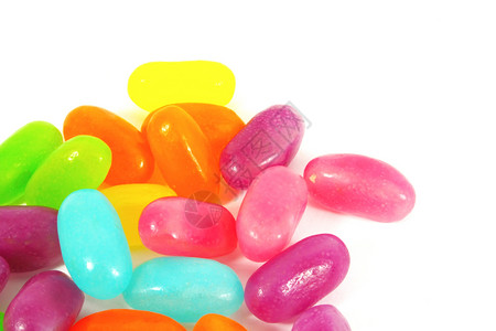 果冻豆款待食品粉色果味紫色小吃水果糖果软糖白色背景图片