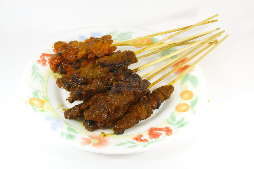 竹棍上被烧的肉片烤串服务肉类小吃味道竹子食物烧烤猪肉午餐图片
