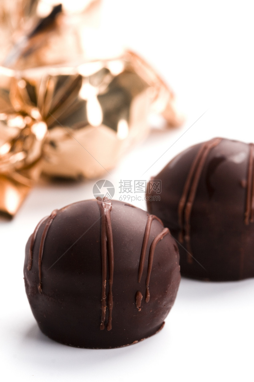 巧克力糖果闭合欲望喜悦美食甜点反射小吃食物挫败可可白色图片