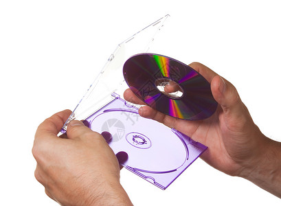 CDROM在手拿着的盒子中电脑玻璃磁盘紫色技术白色背景图片