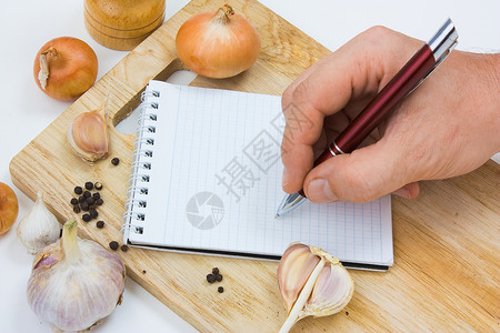 烹饪笔记的笔记本会议室厨房香料记事本食谱洋葱背景图片