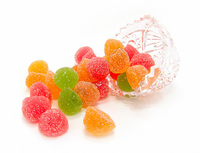 晶体花瓶中的彩色果糖庆典食物甜点孩子软糖问候语橡皮蔗糖绿色水果背景图片