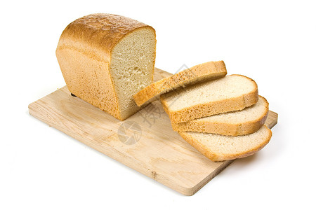 面包在切割板上糕点木板小麦白色背景图片