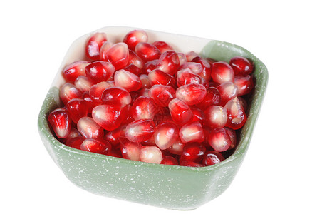 石榴谷物盘子水果宏观粒子颗粒状种子甜点食物红色植物背景图片