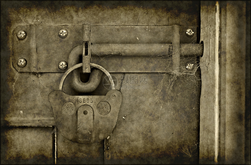 旧锁门风化古董挂锁锁定木头安全栅栏图片