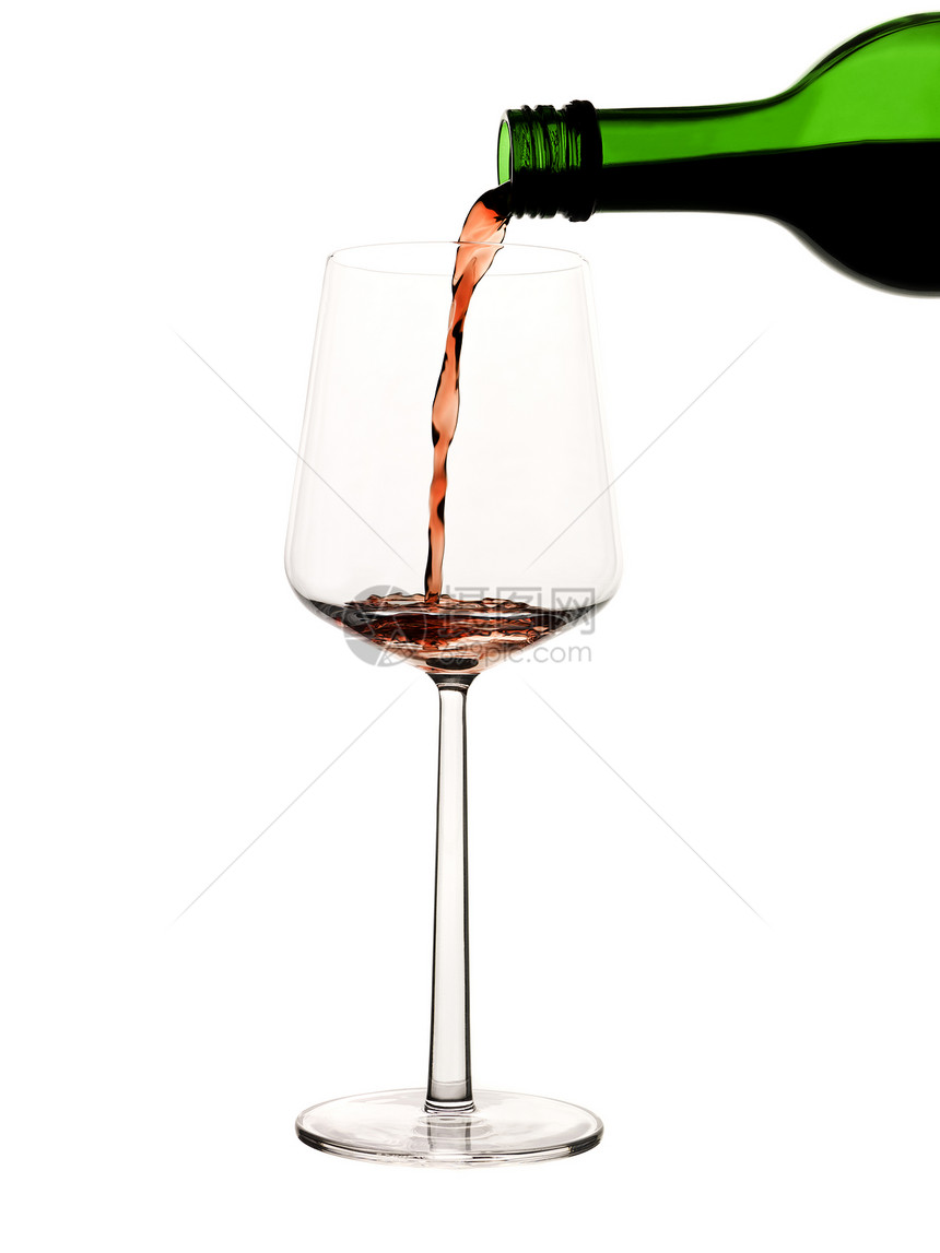 将红酒瓶放在玻璃杯上玻璃泡沫酒杯瓶子白色酒精气泡宏观红色液体图片
