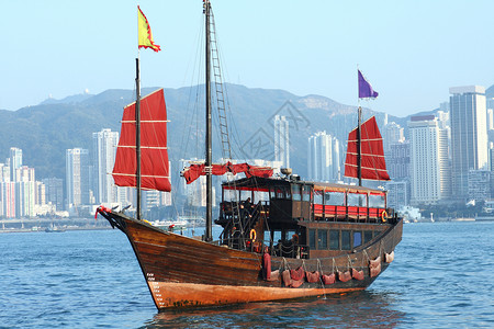 香港废船游客巡航传统渡船运输天空垃圾港口日出旅游背景