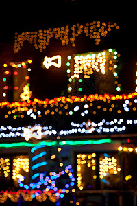 模糊的圣诞节灯光庆典灯泡季节性照明绿色蓝色辉光耀斑火花背景图片