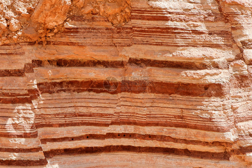 红条形岩质岩石风化条纹棕色红色颜料橙子沉淀材料地质图片