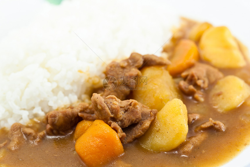 咖喱猪肉加大米饭美食香料立方体美味蔬菜洋葱食物午餐土豆盘子图片