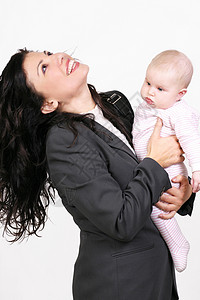 幸福的母亲和婴儿新生新生儿工作乐趣拥抱职业女士女孩培育套装背景图片