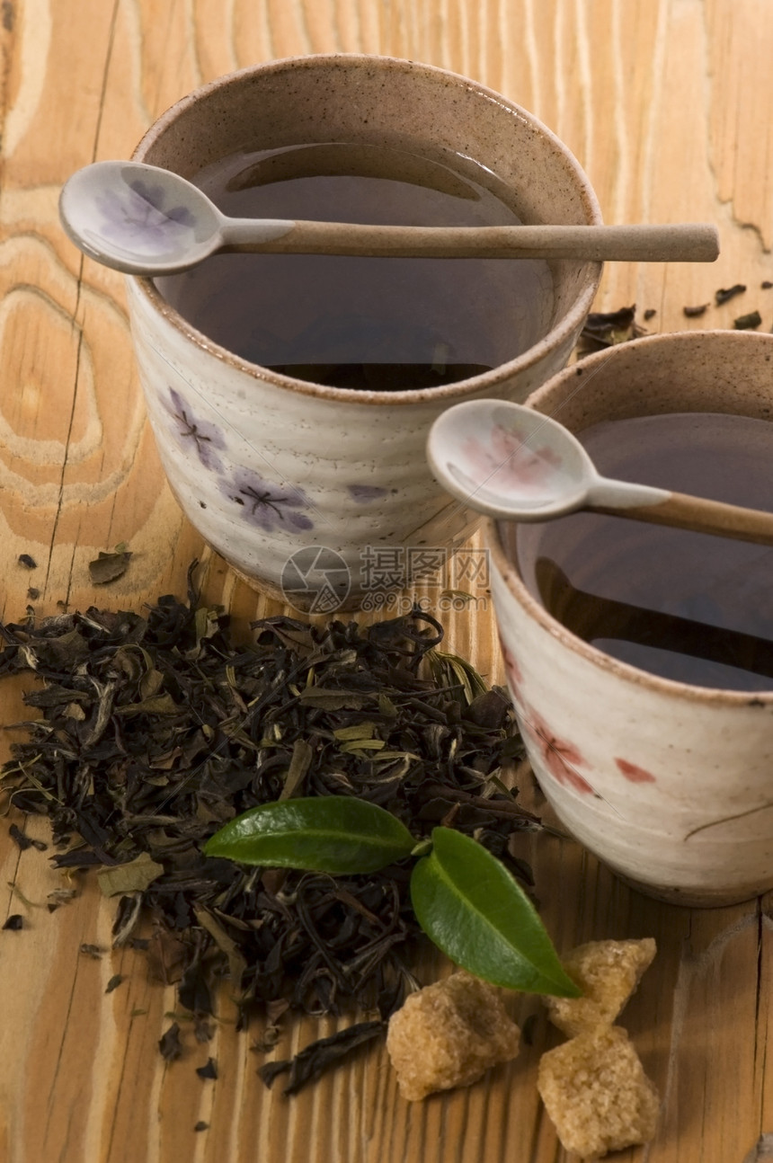 茶杯中含酸树叶的绿茶食谱镜头烹饪宏观仪式金子草本植物时间叶子美食图片