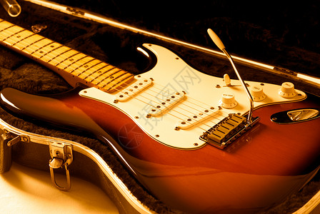 电吉他橙子木头吉他字符串彩色音乐案件乐器艺术金属背景图片
