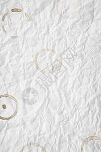 白色皱巴巴的纸文档床单宏观艺术羊皮纸古董腐烂材料滚动背景图片