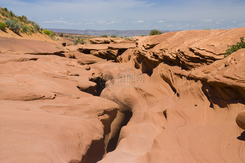亚利桑那州的蚂蚁峡谷侵蚀砂岩红色橙子石头岩石洞穴沙漠狭缝编队图片