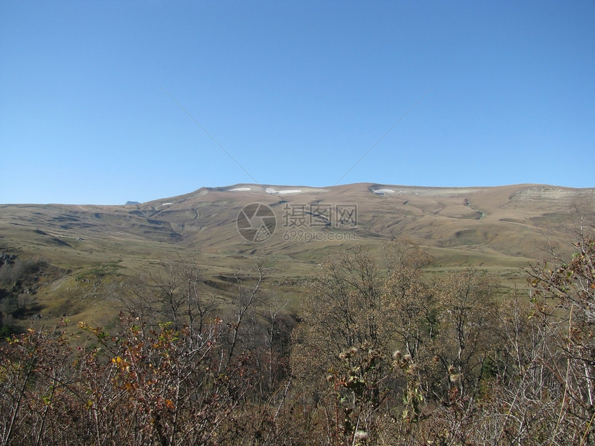 腊果纳基高原天空文件背景草甸山丘剪影全景植被山脉冰川图片