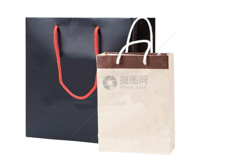 小棕色袋和黑色购物袋 孤立在白色背面图片