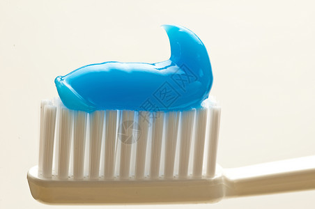 牙刷牙科白色预防牙膏卫生宏观刷子口腔蓝色背景图片