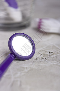 牙科镜像健康护理乐器牙齿医疗镜子工具卫生紫色矫正背景图片