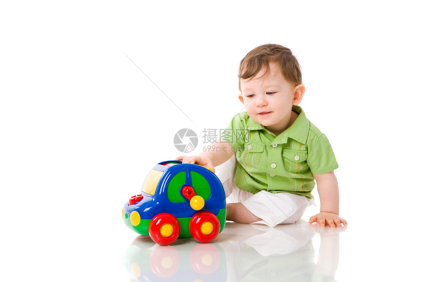 玩婴儿游戏金发喜悦车辆幸福乐趣儿子婴儿好奇心地面男生图片