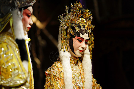 中国歌剧木偶蓝色剧院节日演员化妆品男人窗帘女士文化唱歌背景图片