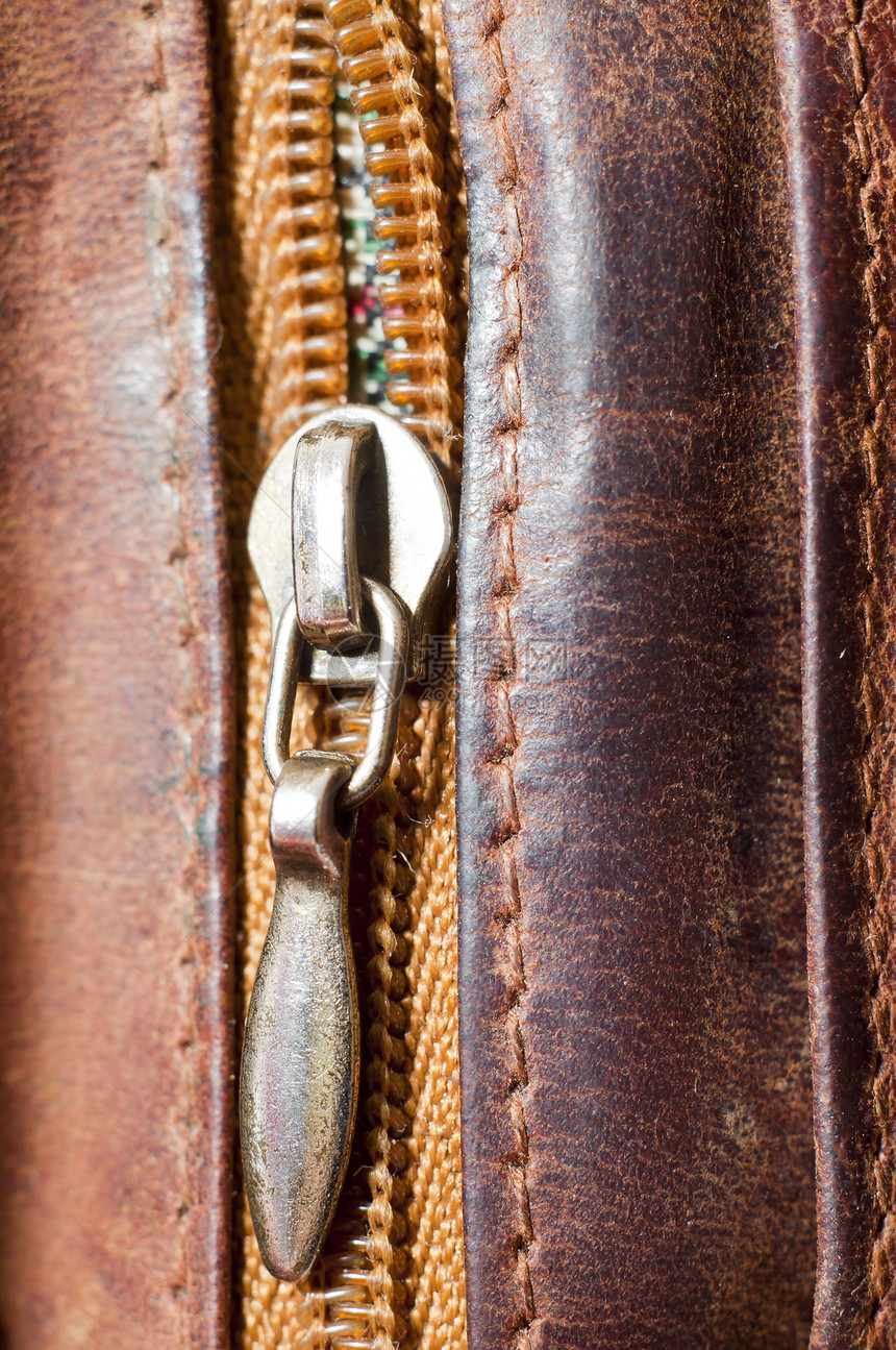棕皮皮拉链缝纫纺织品离别黑色拉链水平紧固件压缩概念金属图片