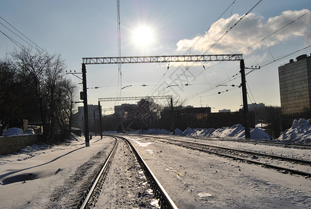 冬季铁路枕木电线两极方法日落铁轨背景图片