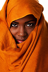 神秘的女神脸孔着头巾橙子色系围巾大地赭石手表眼睛女士游牧民族头饰背景图片