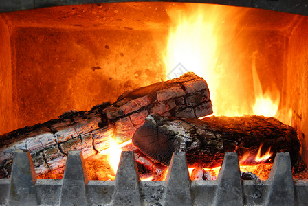 舒适的家居壁炉房子红色装饰日志烟囱木头风格建筑学烧伤火焰背景图片