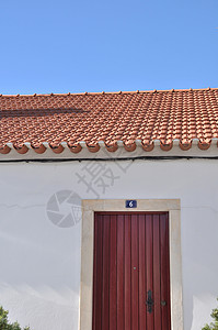 葡萄牙语家门入口瓷砖村庄房子场景红色白色建筑蓝色古董背景图片