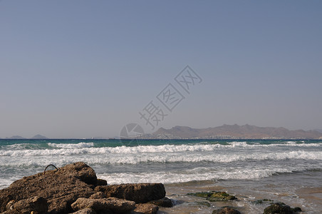 科斯海滩旅游岩石天蓝色蓝色火鸡海景海洋风景石头场景背景图片