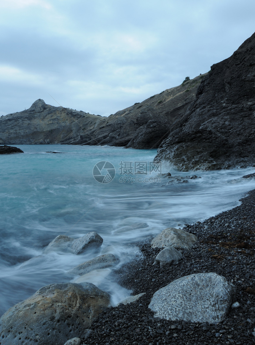 夜间的海海滩天空液体岩石薄雾阳光海岸线海景边缘石头图片