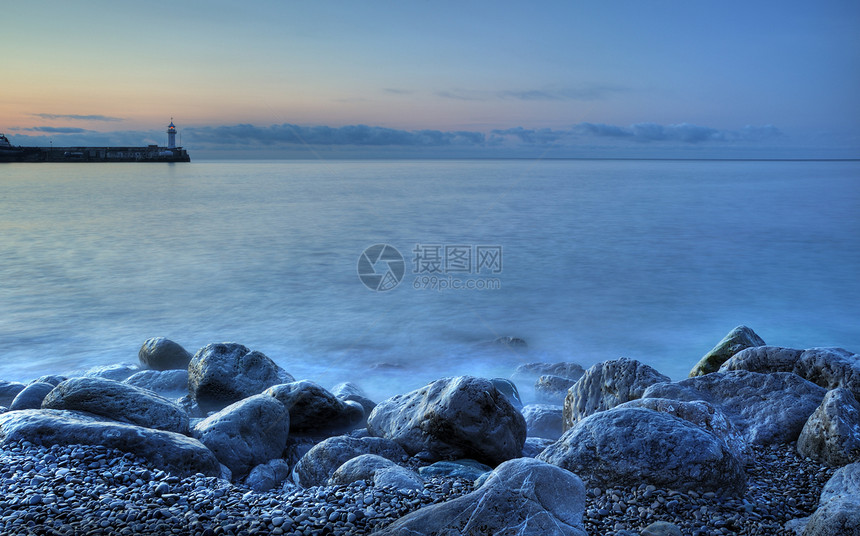 灯泡旅行指导太阳海浪风暴石头蓝色地平线海滩日落图片