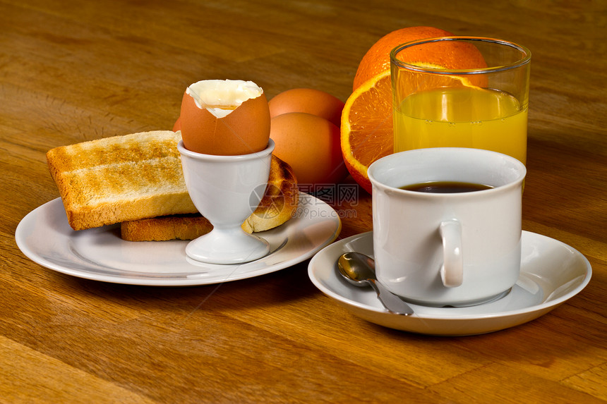 早餐咖啡美食黄油果汁木头勺子蛋壳食物橙子午餐图片