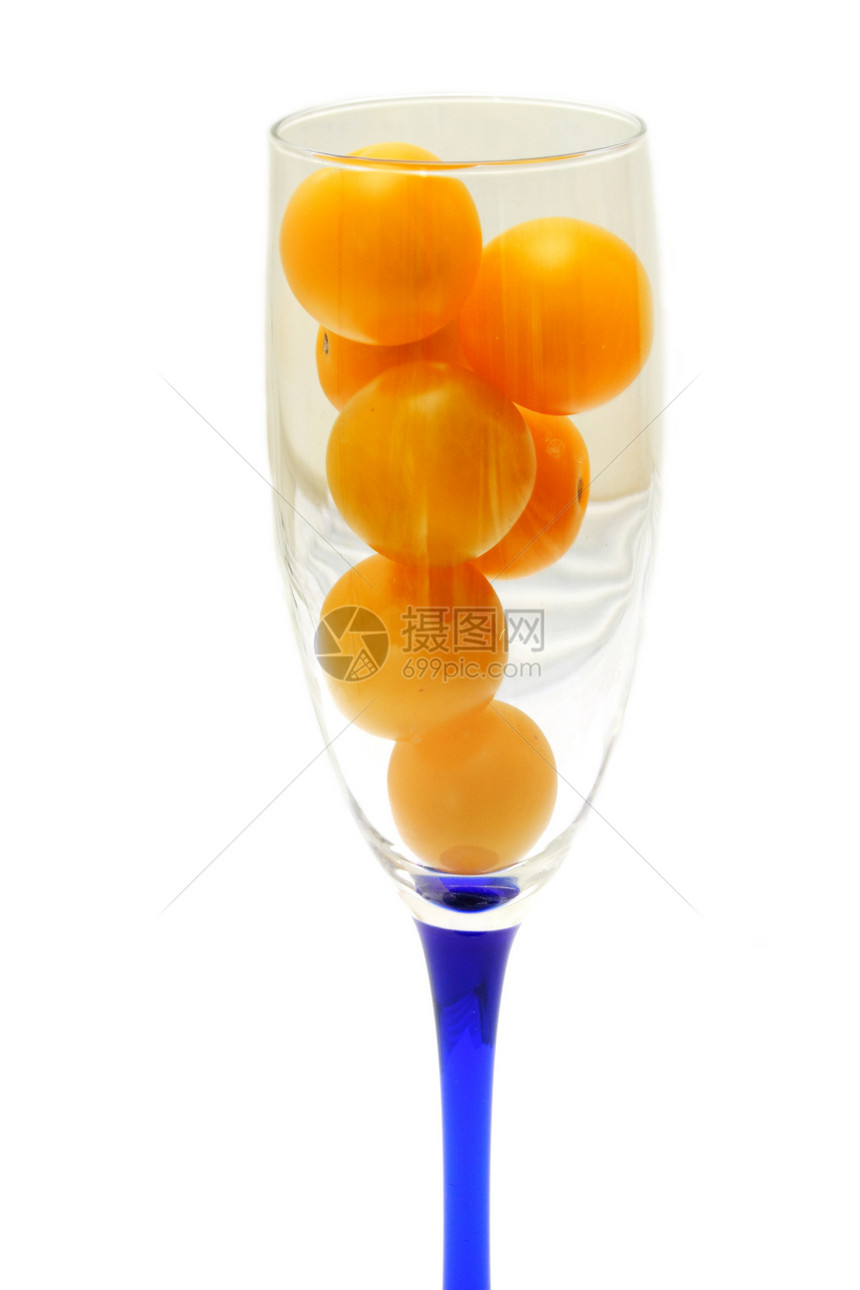 玻璃杯装满黄西红柿胎儿蔬菜团体工作室生长蓝色宏观维生素西红柿饮食图片