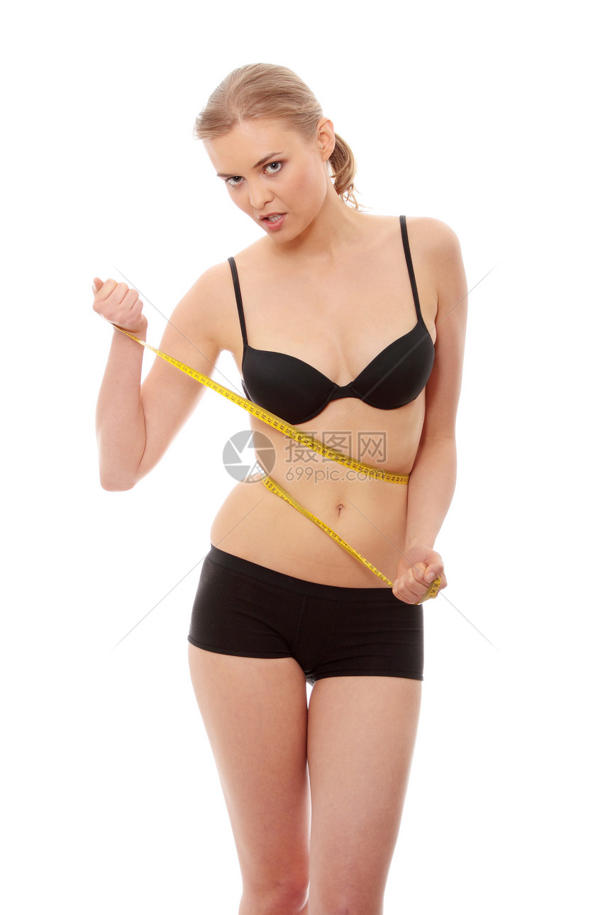 美丽的女人在测量自己的身体饮食皮肤女士重量运动女性女孩橘皮磁带营养图片