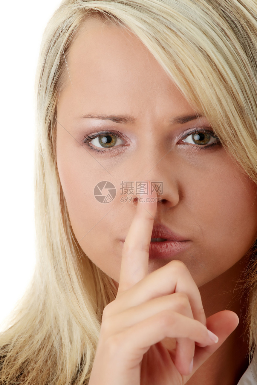 女商务人士 用她的手指在嘴唇上图片