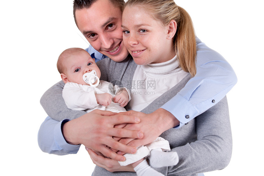 快乐的小家庭眼神父亲夫妻母亲拥抱压痛情侣新生幸福父母图片