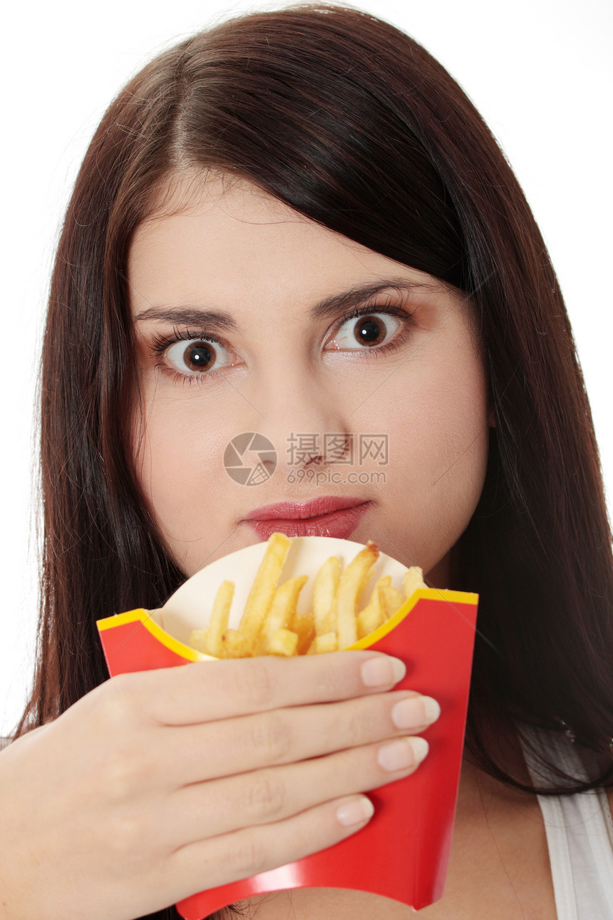 年轻妇女吃炸薯条土豆饮食饥饿快乐垃圾女孩小吃幸福筹码营养图片