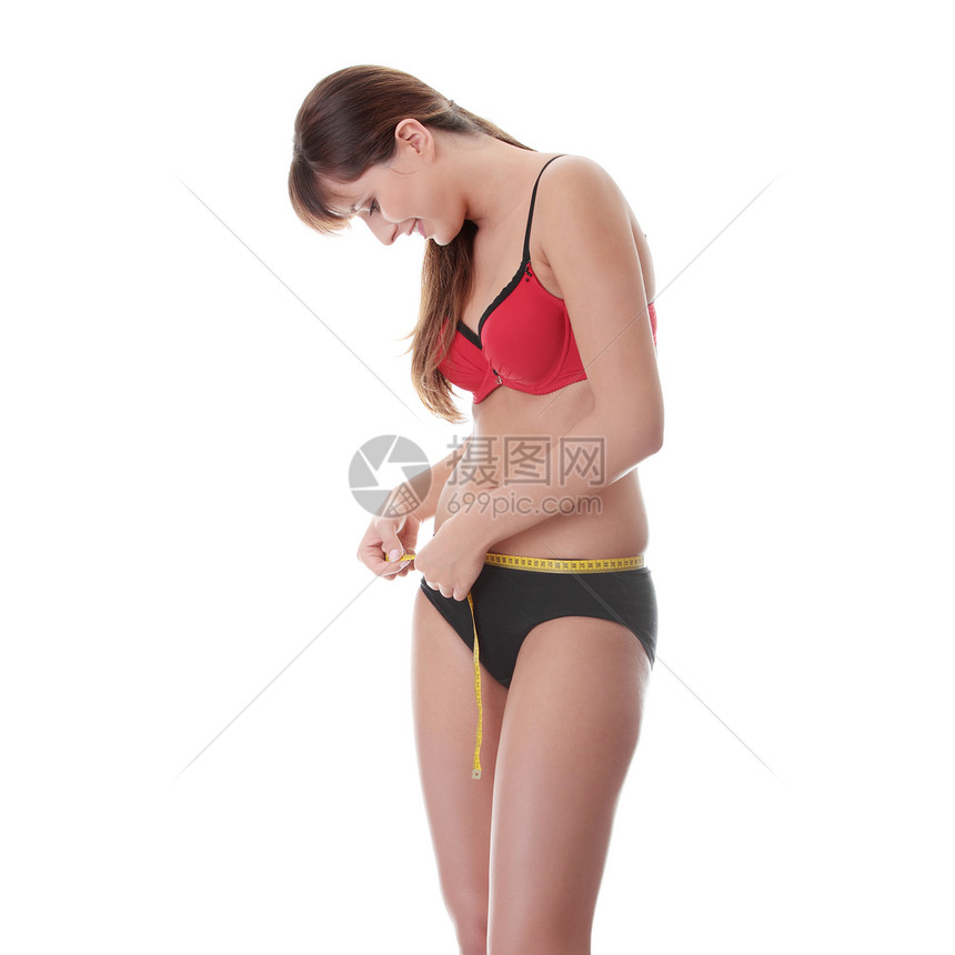 测量腰部的年轻女子厘米磁带饮食女士臀部内衣按钮重量微笑厌食症图片