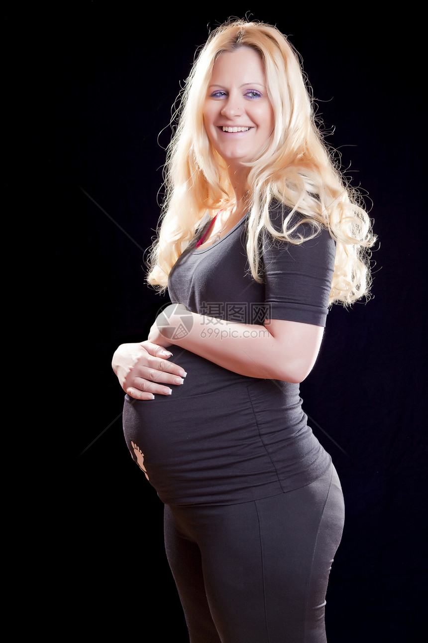 怀孕孕妇的肚子幸福成人木乃伊母亲黑色家庭孩子妈妈裙子身体图片