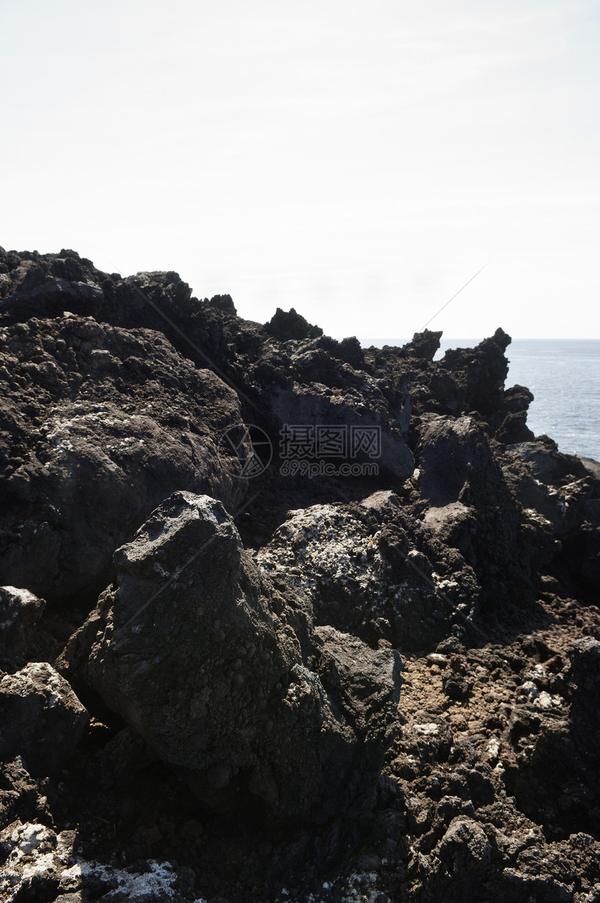 火山岩支撑悬崖边缘海岸线火山蓝色海岸海景地质地质学图片