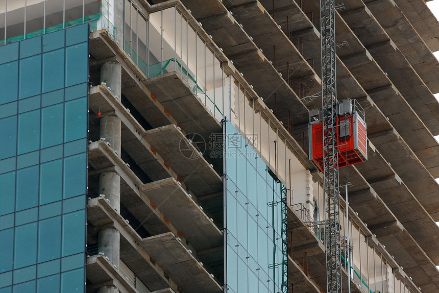 建筑施工城市构造建筑学商业中心框架玻璃景观工作起重机图片