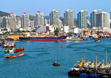 城市盛大开盘中国三亚凤凰岛港旅行壁垒游客渡船工作城市绿色蓝色过境商业背景