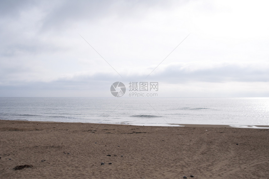 海滩沙滩海洋海浪天空土地海岸图片