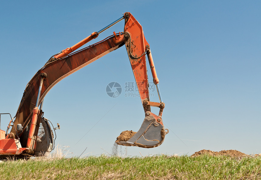 液压挖掘器臂和水桶照片绿色反铲橙子水平挖掘机地球图片