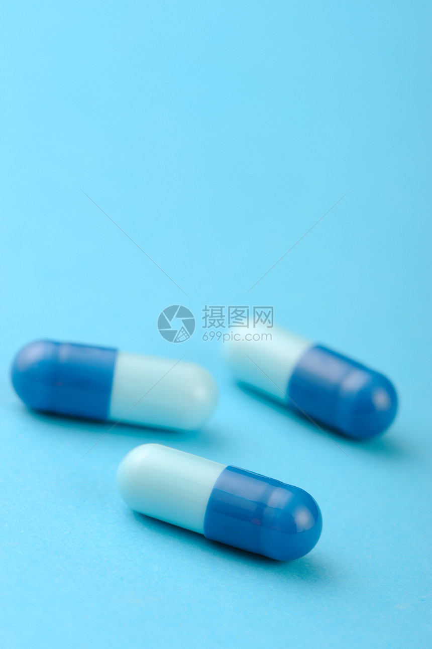 蓝色背景上设置胶囊化学阴影科学药物白色疾病药品维生素团体药理图片
