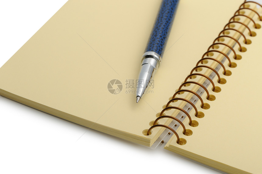 笔和笔记本 在黄纸的螺旋上写作白色黄色戒指文档软垫办公室墨水金属日记图片